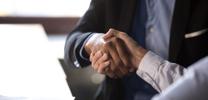 Close up african american businessman shaking hands with caucasian client. Handshake is symbol of starting finishing negotiations, successful teamwork signing contract, hiring human resource concept